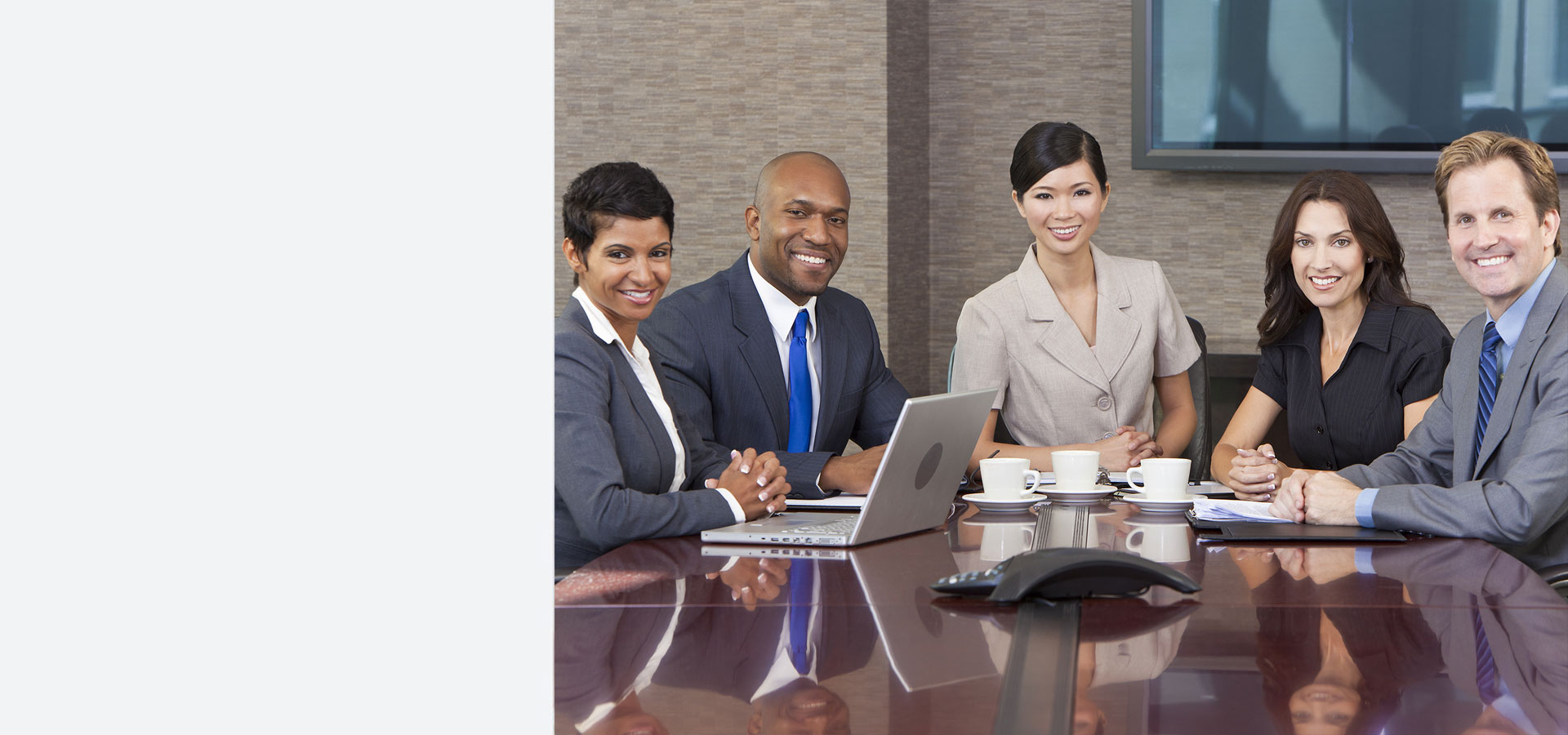 Business people sitting in a meeting - Hampton Pryor Group
